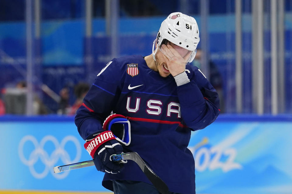 United States' Andy Miele (51) leaves the ice after the United States lost to Slovakia in a men's quarterfinal hockey game at the 2022 Winter Olympics, Wednesday, Feb. 16, 2022, in Beijing. Slovakia won 3-2 in a shoot-out. (AP Photo/Matt Slocum)