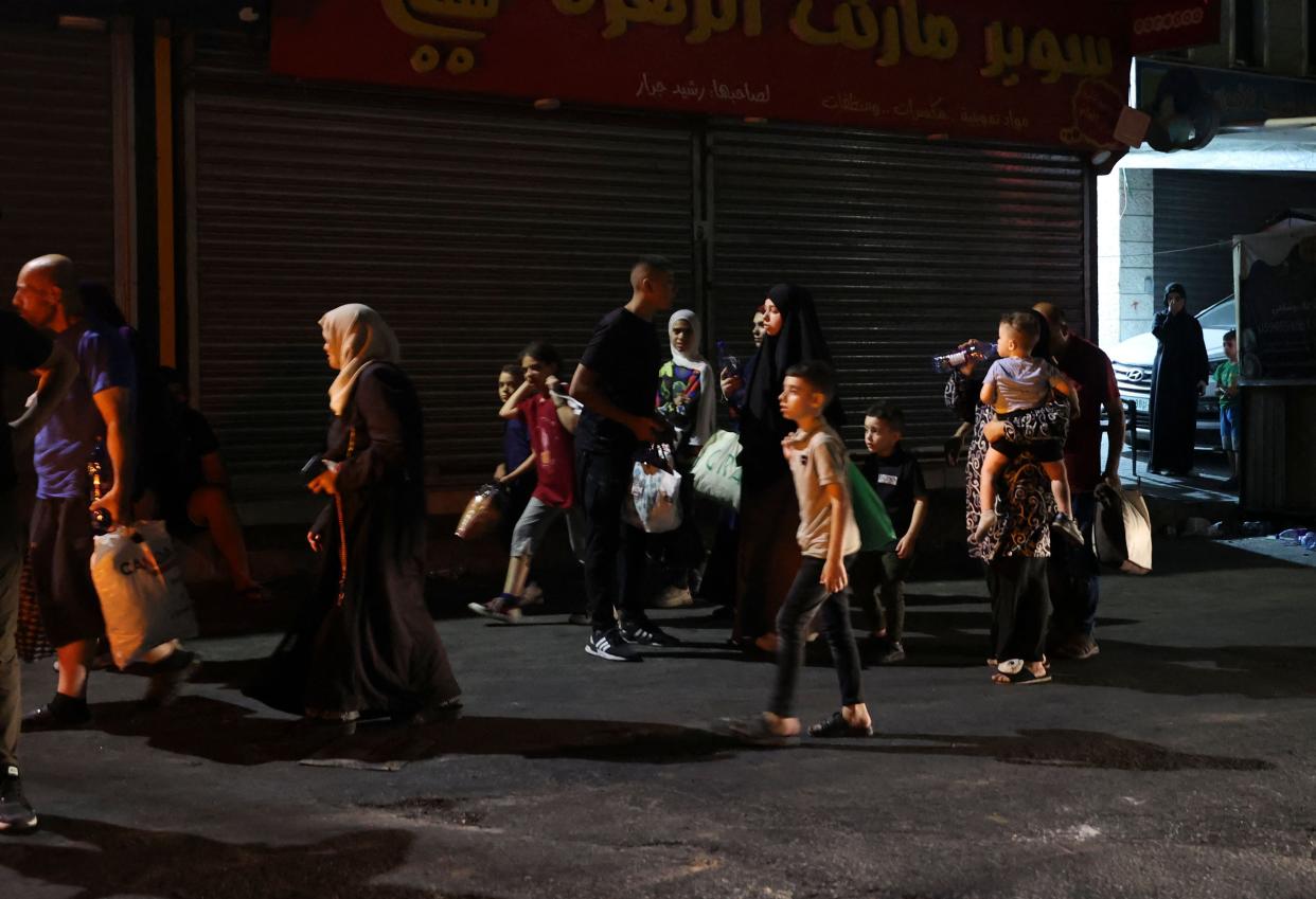 Residents evacuate the Jenin refugee camp during an Israeli military operation in the occupied West Bank (AFP via Getty Images)