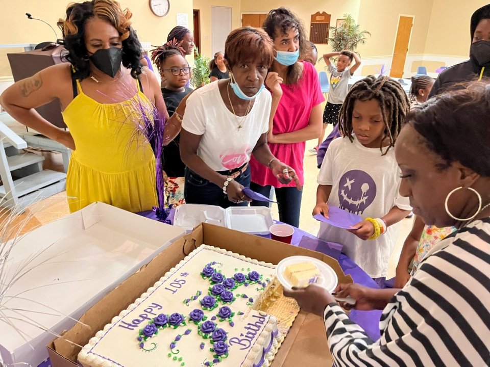 Family and friends share cake at the 105th birthday celebration for Lula Mae Taylor, held June 25, 2022 in Candler.