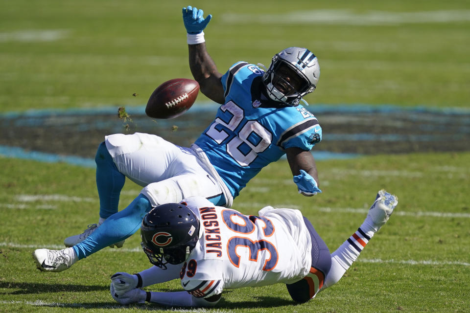 Carolina Panthers running back Mike Davis (28) loses the ball while Chicago Bears free safety Eddie Jackson (39) makes the hit during the second half of an NFL football game in Charlotte, N.C., Sunday, Oct. 18, 2020. (AP Photo/Brian Blanco)