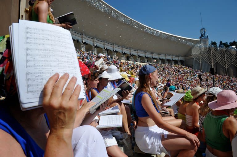 Singers are seen during a rehearsal for the Song and Dance festival in Riga, Latvia, on July 4, 2013. The weeklong celebration culminates on July 7 when 12,000 people deliver old folk songs in pitch-perfect unison at a forest amphitheatre in Riga