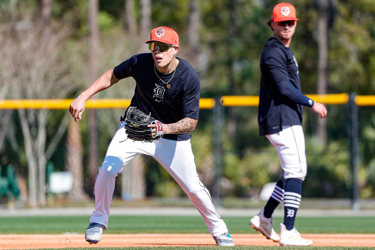 Tigers infielder Gio Urshela practices a drill next to outfielder Zach McKinstry during spring training at TigerTown in Lakeland, Florida. on Friday, Feb. 23, 2024.