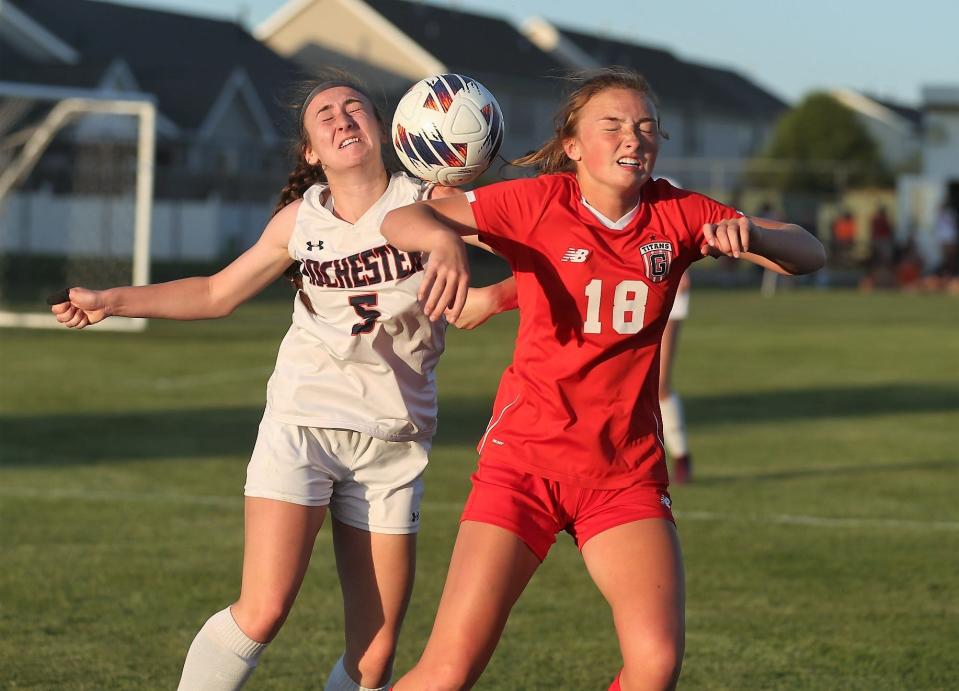 Rochester's Claire Carmean, left, and Chatham Glenwood's Rowann Law battle for the ball during the second half of the Class 2A Normal West girls soccer sectional final on Friday, May 26, 2023.