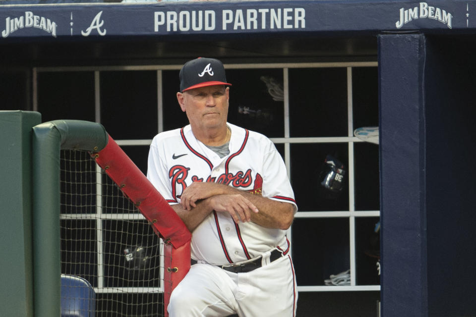 Atlanta Braves manager Brian Snitker looks on from the dugout in the sixth inning of a baseball game against the San Francisco Giants Wednesday, June 22, 2022, in Atlanta. (AP Photo/Hakim Wright Sr.)