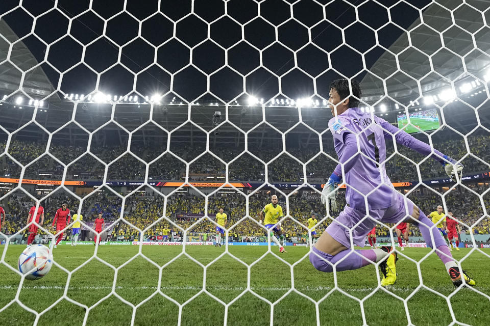 Brazil's Neymar scores his side's second goal from the penalty spot during the World Cup round of 16 soccer match between Brazil and South Korea, at the Education City Stadium in Al Rayyan, Qatar, Monday, Dec. 5, 2022. (AP Photo/Manu Fernandez)