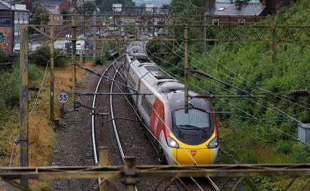 A Virgin Trains West Coast Mainline service from London to Manchester pulls out of the station in Macclesfield