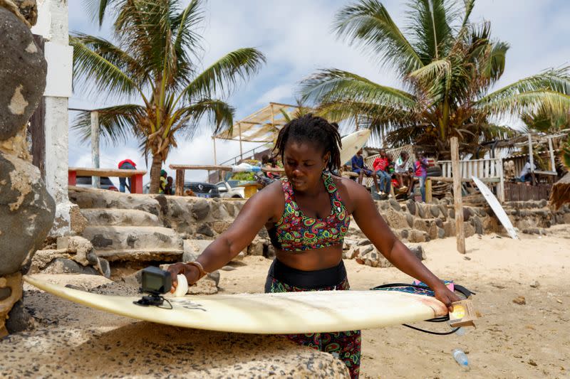 Wider Image: Meet Senegal's first female pro surfer inspiring girls to take to the waves