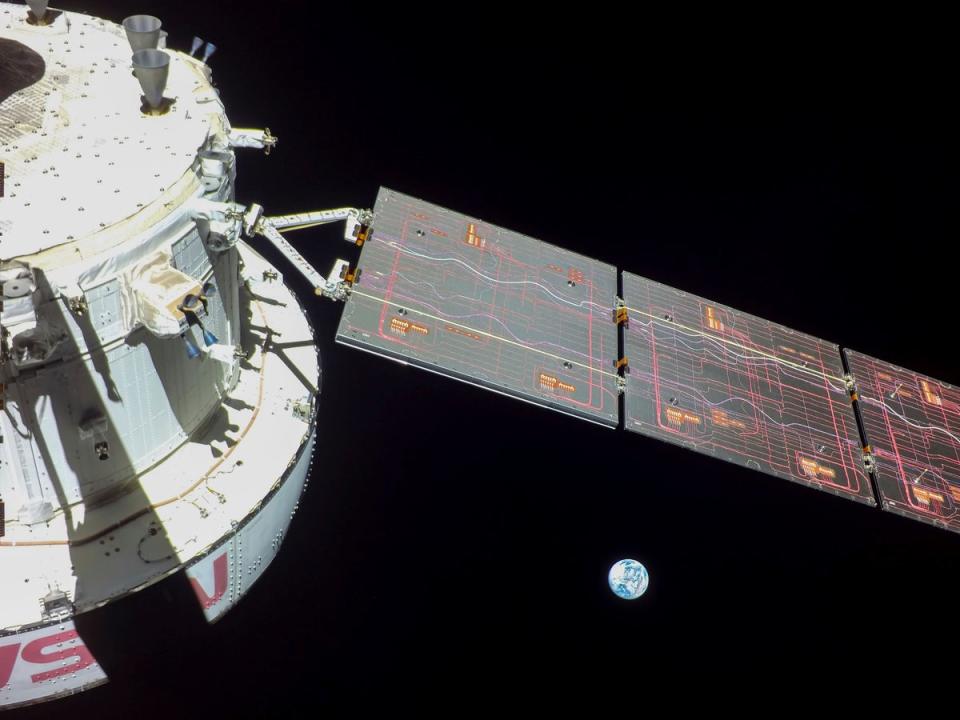 Imagery that NASA's Orion spacecraft captured looking back at the Earth from a camera mounted on one of its solar arrays ((NASA via AP))