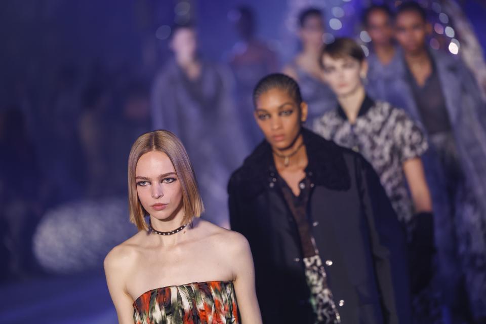 Models wear creations as part of the Christian Dior Fall/Winter 2023-2024 ready-to-wear collection presented Tuesday, Feb. 28, 2023 in Paris. (Vianney Le Caer/Invision/AP)