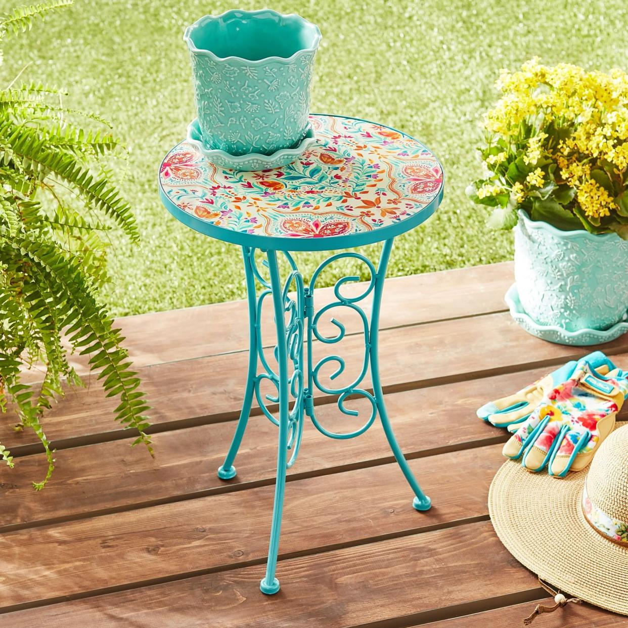 <p><a href="https://go.redirectingat.com?id=74968X1596630&url=https%3A%2F%2Fwww.walmart.com%2Fip%2FPioneer-Woman-Folk-Geo-Ceramic-Top-Plant-Stand%2F1492371738&sref=https%3A%2F%2Fwww.thepioneerwoman.com%2Fproducts%2Fa60651313%2Fthe-pioneer-woman-bistro-set-walmart%2F" rel="nofollow noopener" target="_blank" data-ylk="slk:Shop Now;elm:context_link;itc:0;sec:content-canvas" class="link rapid-noclick-resp">Shop Now</a></p><p>The Pioneer Woman Folk Geo Ceramic Top Plant Stand</p><p>walmart.com</p><p>$26.98</p>