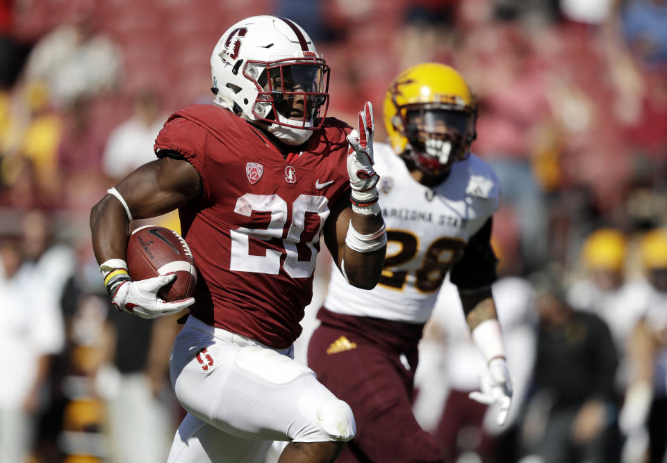 With his 301 rushing yards and three touchdowns on Saturday, Bryce Love (L) has established himself as one of the best backs in the country. (AP Photo/Marcio Jose Sanchez)