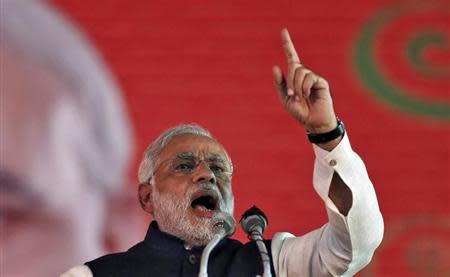 Hindu nationalist Narendra Modi, prime ministerial candidate for India's main opposition Bharatiya Janata Party (BJP) and Gujarat's chief minister, speaks during their national council meeting at Ramlila ground in New Delhi January 19, 2014. REUTERS/Adnan Abidi/Files