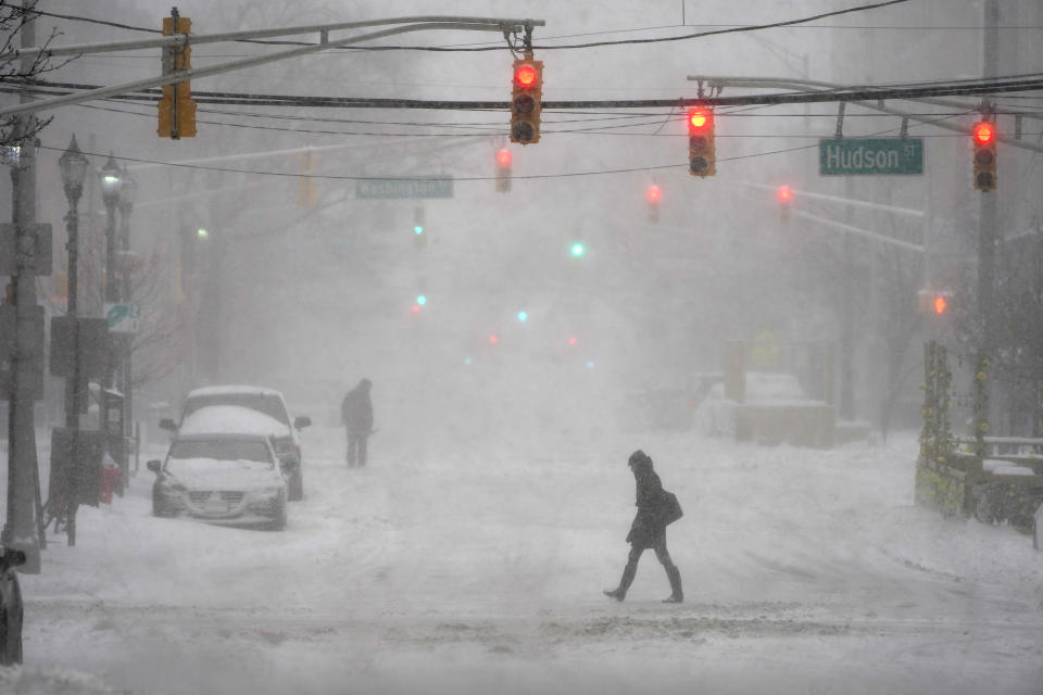 Pedestrians make their way through heavy snow and wind in Hoboken, N.J., Monday, Feb. 1, 2021. (AP Photo/Seth Wenig)