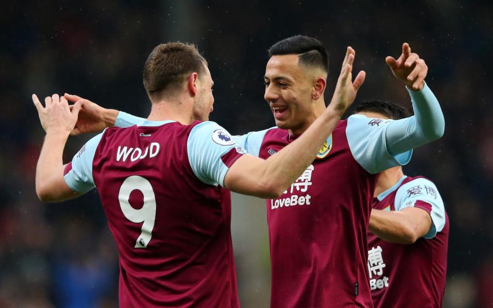 Dwight McNeil, right, has set up three goals for Burnley's Chris Wood this season - Getty Images Europe