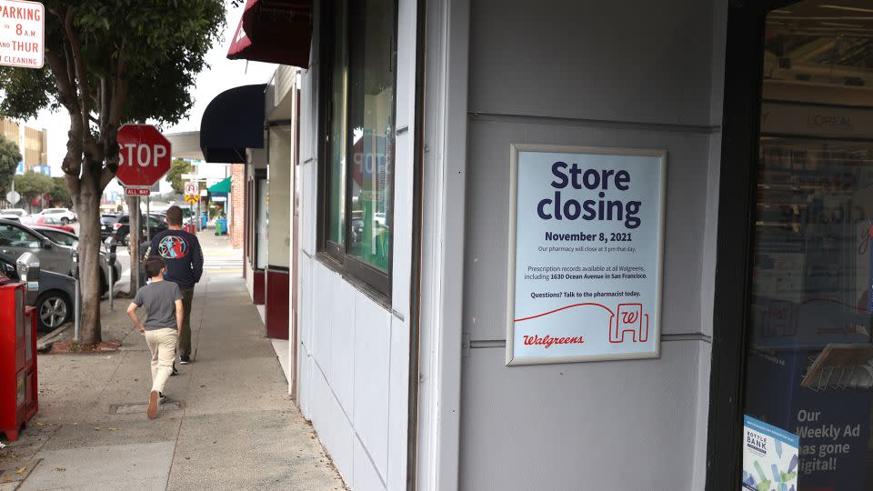 Pedestrians walk by a Walgreens store that is set to be closed in the coming weeks on October 13, 2021 in San Francisco, California. - Justin Sullivan/Getty Images