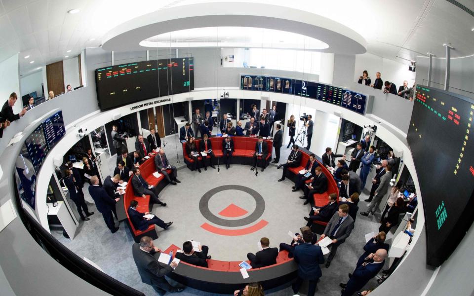 Traders operate in the Ring, the open trading floor of the new London Metal Exchange (LME) in central London.  - AFP