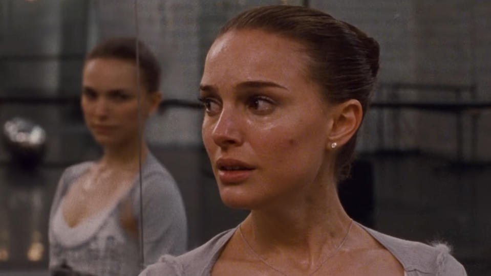 Nina (Natalie Portman) doesn't realize her reflection has turned to look at her