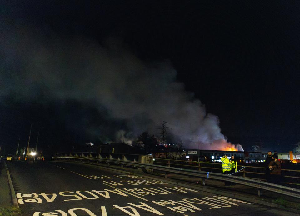 A large plume of smoke rises from a fire at the Treforest Industrial Estate in Pontypridd, Wales, Britain, 14 December 2023 (EPA)