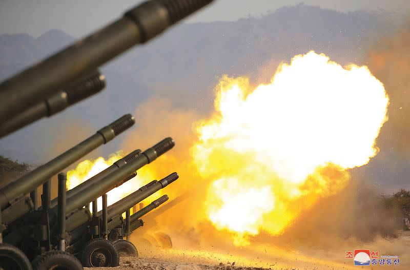 FILE PHOTO: North Korea leader Kim Jong Un observes artillery fire competition in North Korea