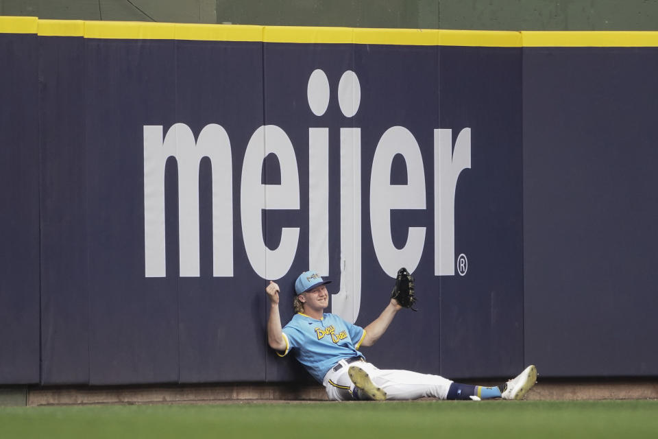 Milwaukee Brewers' Joey Wiemer reacts after failing to catch a three-run home run by Pittsburgh Pirates' Alfonso Rivas during the first inning of a baseball game Friday, Aug. 4, 2023, in Milwaukee. (AP Photo/Aaron Gash)