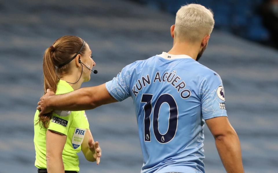 Sergio Aguero touches Sian Massey-Ellis on the shoulder during City's 1-0 victory over Arsenal  - GETTY IMAGES