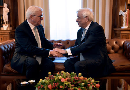 Greek President Prokopis Pavlopoulos (R) meets with German President Frank-Walter Steinmeier at the Presidential Palace in Athens, Greece, October 11, 2018. REUTERS/Michalis Karagiannis/Pool