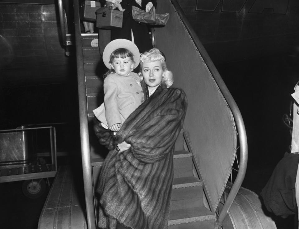 Turner and Cheryl descend from an airplane in 1946. Bettmann Archive