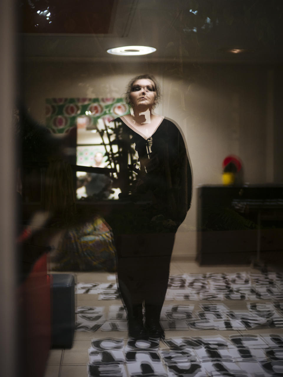 Mathilde, 35, a musician from Paris, is reflected in a window as she poses for a portrait in Paris. After Mathilde experienced domestic violence when she was 20 years old, she feels today like a survivor. The police's inaction in her case, propelled her to become an activist by pasting signs in the streets. (Photo: Kamil Zihnioglu/AP)