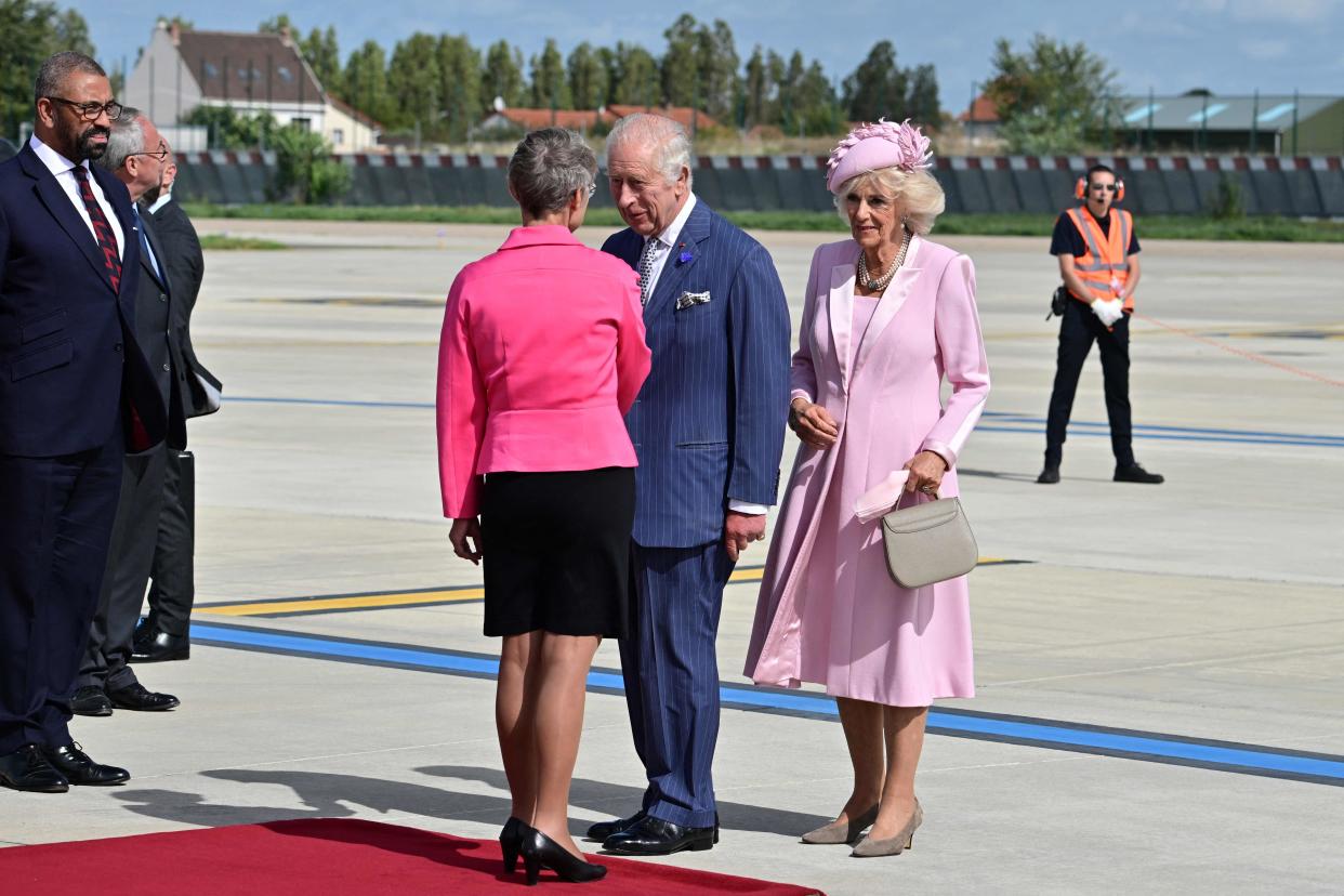 French Prime Minister Elisabeth Borne (L) greets Britain’s King Charles III (C) and Britain’s Queen Camilla (R) upon arrival at the Orly Airport on September 20, 2023 (POOL/AFP via Getty Images)