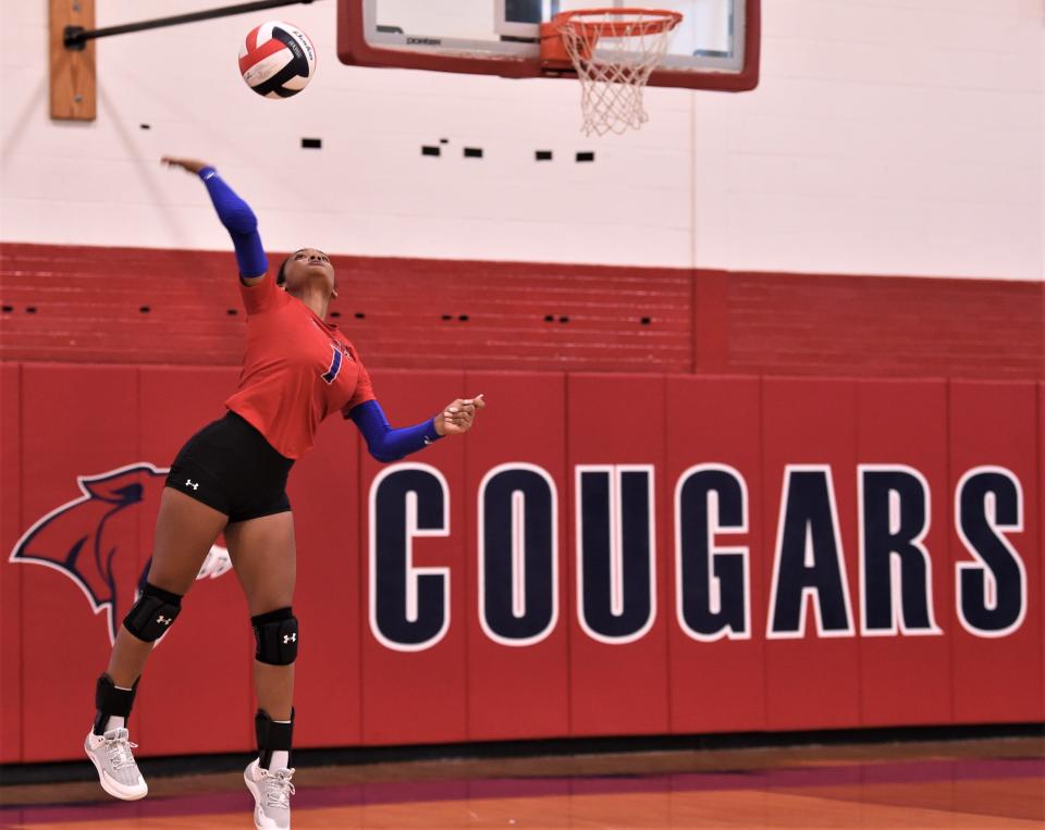 Cooper's Jaedah Titus serves the ball to Eastland during pool play at the Bev Ball Classic on Friday at Cougar Gym. Cooper beat the Lady Mavs 25-18, 25-20.