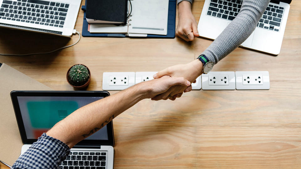 shaking hands at office.