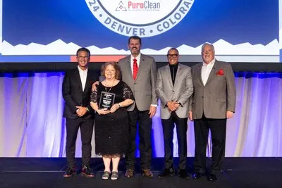 Pictured L-R: Mark W. Davis, Chairman and CEO, Sharon Atkins, Charles Atkins, Frank Torre, Vice Chairman, and Steve White, President and COO.