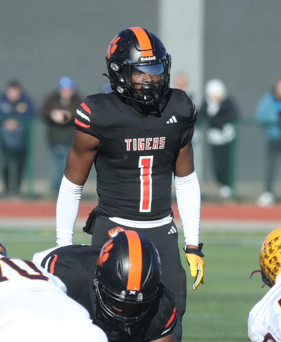 Belleville's Jeremiah Beasley lines up in defense against Davison during first-half action at Novi High School on Saturday, Nov. 18, 2023.