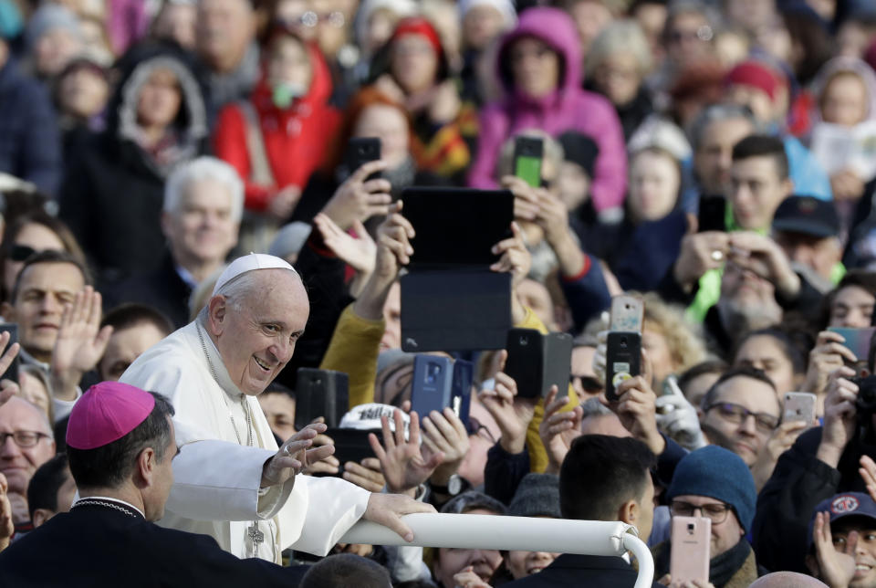 Pope Francis greets faithful as he arrives in Freedom Square to celebrate a Mass in Tallinn, Estonia, Tuesday, Sept. 25, 2018. Pope Francis concludes his four-day tour of the Baltics visiting Estonia. (AP Photo/Andrew Medichini)