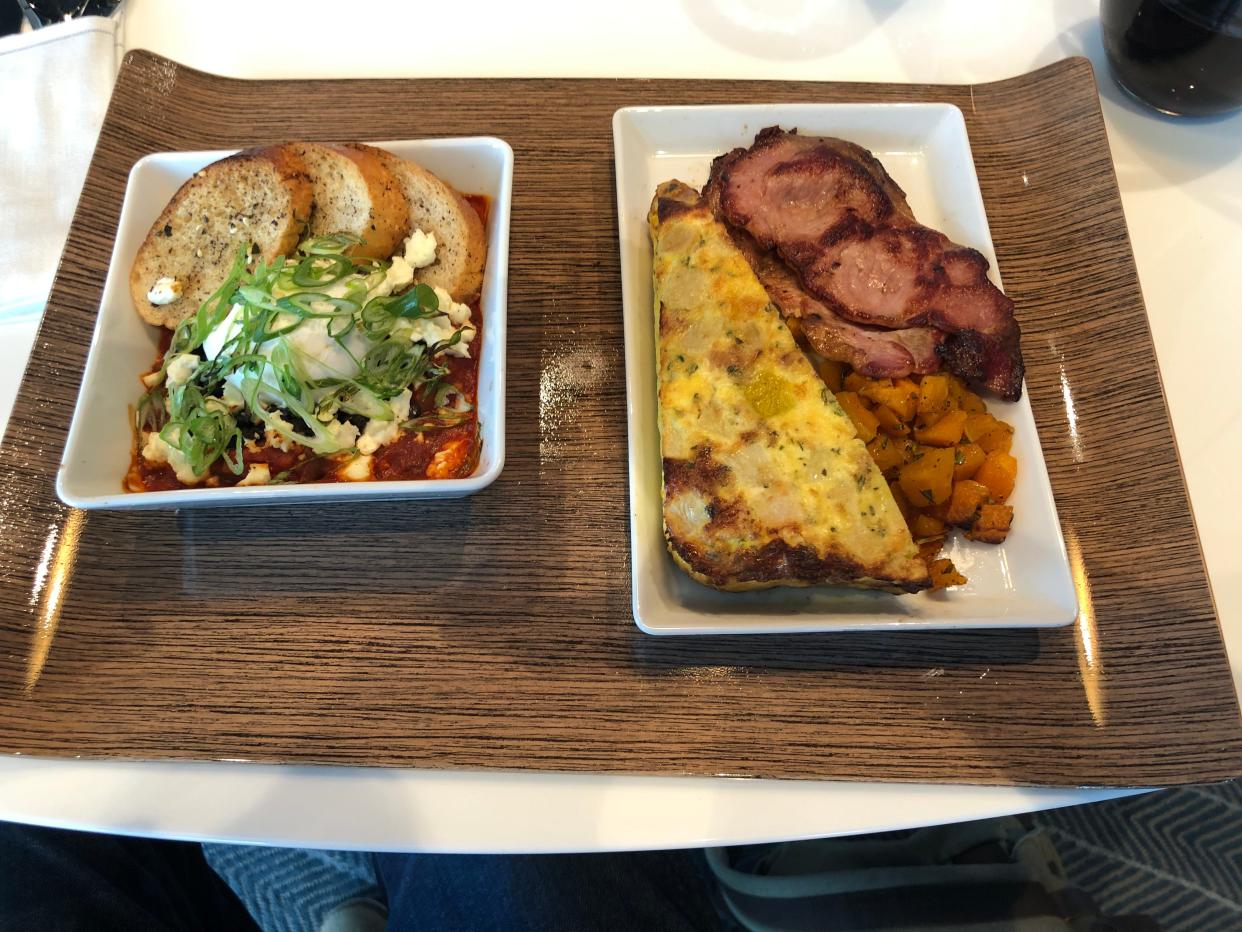 Alaska's First class breakfast shakshuka and egg, bacon and squash dishes.