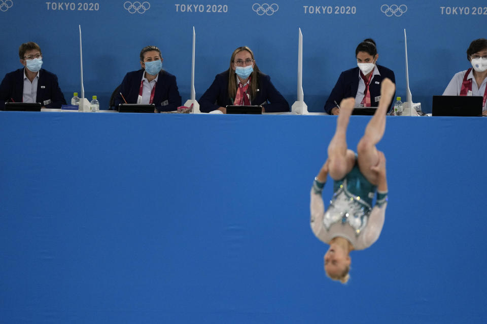 FILE - In this July 25, 2021, file photo, judges evaluate Asia D'Amato, of Italy, performing her floor exercise during the women's artistic gymnastic qualifications at the 2020 Summer Olympics in Tokyo. (AP Photo/Gregory Bull, File)