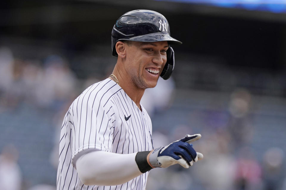 New York Yankees designated hitter Aaron Judge reacts after drawing a bases-loaded walk for the winning run in the Yankees 5-4 win over the Chicago White Sox in a baseball game, Sunday, May 23, 2021, at Yankee Stadium in New York. The Yankees Clint Frazier scored on the play. (AP Photo/Kathy Willens)