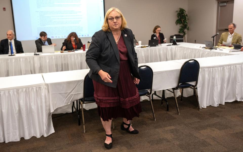 Interim UW- La Crosse Chancellor Betsy Morgan gets up after testifying at a disciplinary hearing to decide whether Joe Gow, background right, should be fired as a faculty member from the University of Wisconsin-La Crosse on Wednesday, June 19, 2024 in Onalaska, Wisconsin.