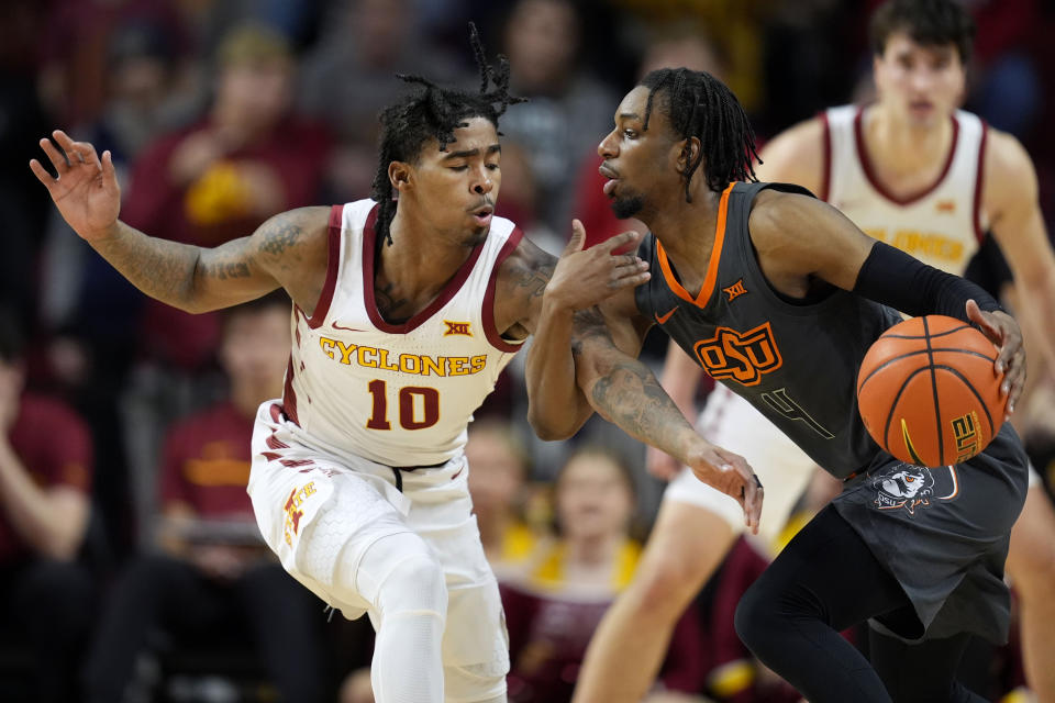 Iowa State guard Keshon Gilbert (10) tries to steal the ball from Oklahoma State guard Jarius Hicklen (4) during the second half of an NCAA college basketball game, Saturday, Jan. 13, 2024, in Ames, Iowa. Iowa State won 66-42. (AP Photo/Charlie Neibergall)