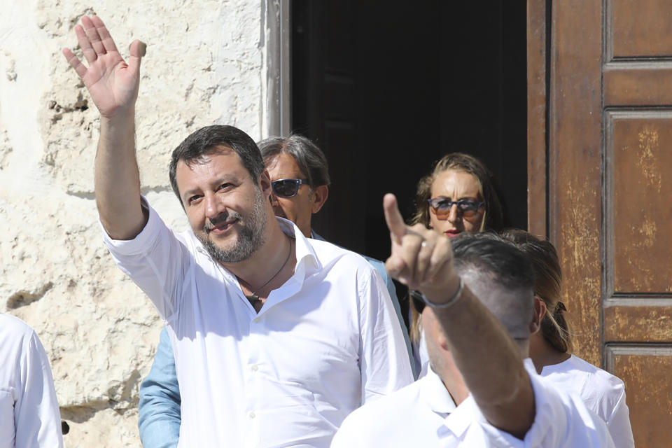 Italy's former Interior minister, Matteo Salvini and Leader of The League party, leaves the town hall building during his visit in the Sicilian Island of Lampedusa, Italy, Thursday, Aug. 4, 2022. Salvini is making a stop Thursday on Italy's southernmost island of Lampedusa, the gateway to tens of thousands of migrants arriving in Italy each year across the perilous central Mediterranean Sea. (AP Photo/David Lohmueller)