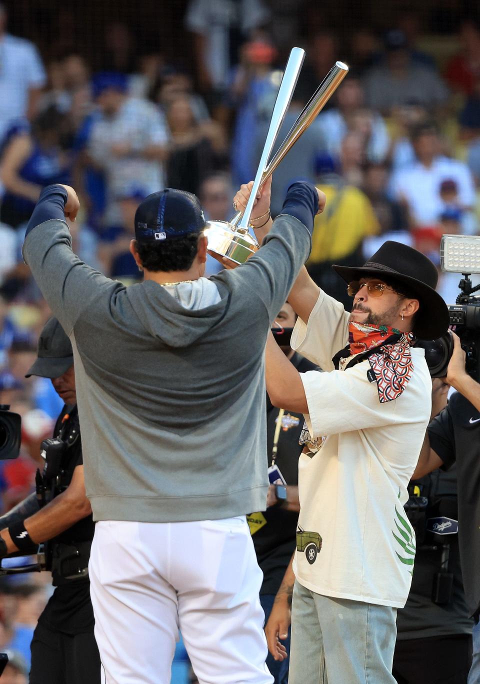 LOS ANGELES, CALIFORNIA - JULY 18: Rapper Bad Bunny holds up the 2022 T-Mobile Home Run Derby trophy at Dodger Stadium on July 18, 2022 in Los Angeles, California. (Photo by Sean M. Haffey/Getty Images)