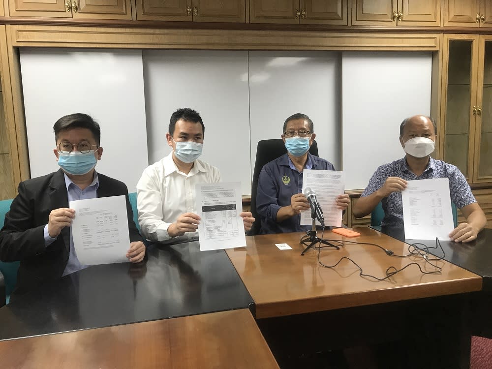 (From left) Menglembu assemblyman Steven Chaw, Keranji assemblyman Chong Zhemin, Sungai Rapat assemblyman Datuk Seri Mohammad Nizar Jamaluddin and Jelapang assemblyman Cheah Poh Hian showing the documents related to the financial positions of PCBD at the Banguan Perak Darul Ridzuan. — Picture by John Bunyan