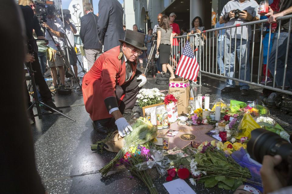 A makeshift memorial to Robin Williams along the Hollywood Walk of Fame, following the star's death in August 2014.