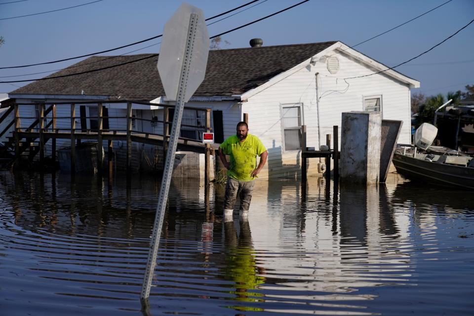 Nathan Fabre checks on his home and boat destroyed by Hurricane Ida, Sunday, Sept. 5, 2021, in Lafitte, La. "We lost everything," Fabre said.