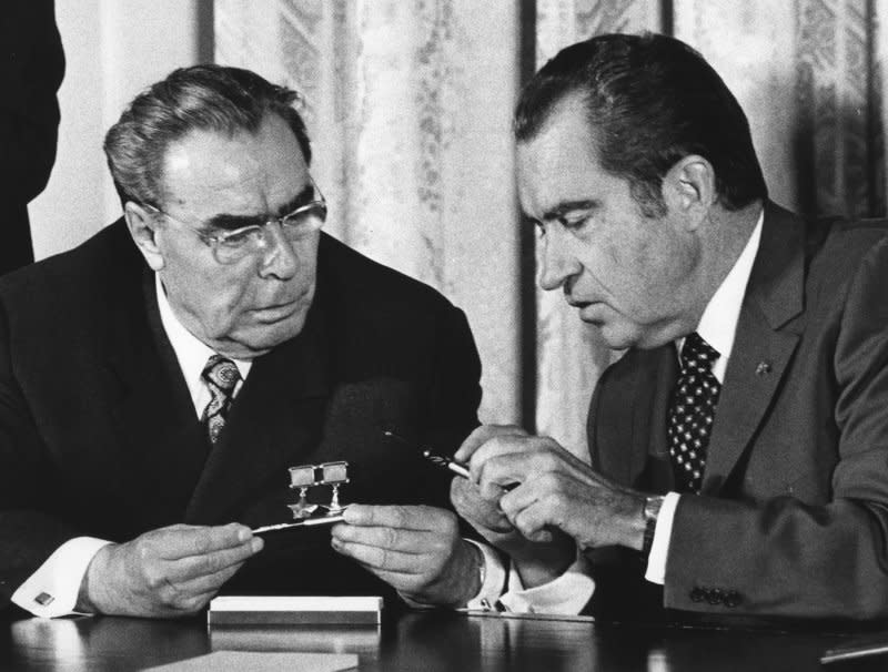 President Richard Nixon and Soviet Communist Party Chief Leonid Brezhnev exchange pens used in signing an agreement on June 22, 1973, to avoid military confrontations and threats of force that might trigger nuclear war. The ceremony was in the East Room of the White House in Washington. File Photo by Frank Cancellare/UPI