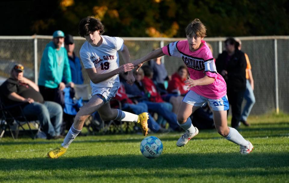 Toll Gate's Nathan Pelletier, left, and Scituate's Mason Brown race for a loose ball during Tuesday's game.