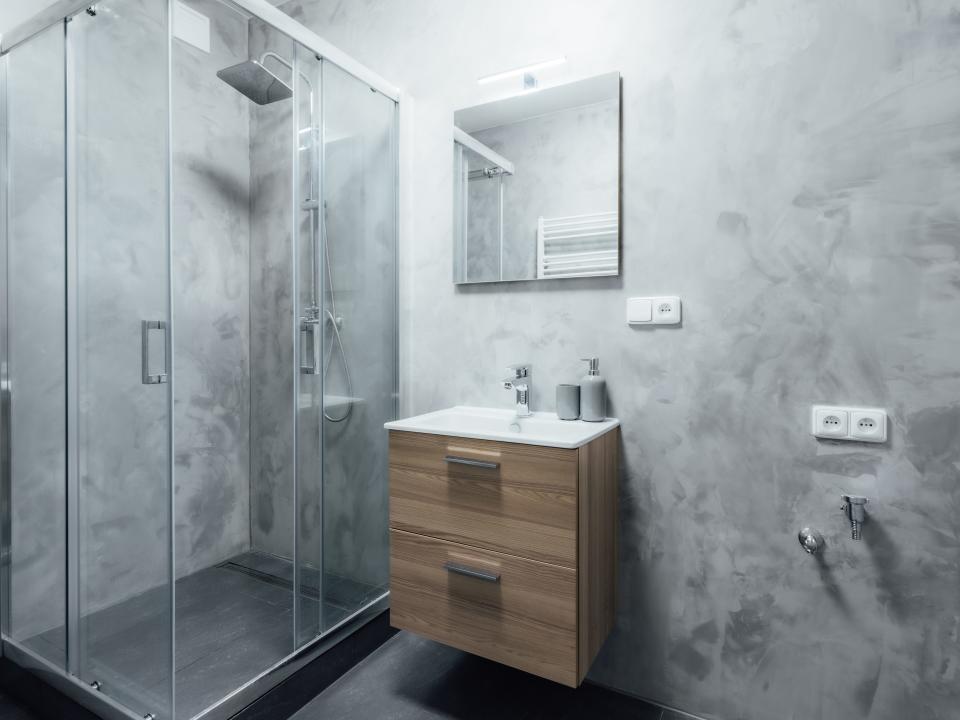 All gray bathroom with wooden vanity