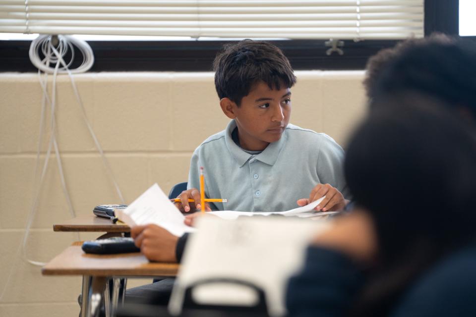 Axel Inestroza works on a worksheet in an eighth grade math class Friday at Mendez Middle School. The East Austin school is now being run by Third Future Schools, a charter school company.