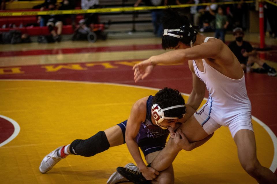 La Quinta's Ryan Sanchez going for the single-leg takedown against Rancho Mirage's Kyle Tan at the DEL Varsity Finals, Jan. 22, 2022.