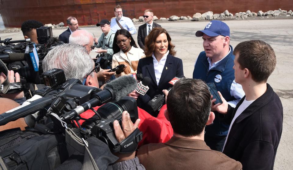 Members of the media interview Governor Gretchen Whitmer and Port of Monroe Director Paul LaMarre (right) Monday after the tour of the Port of Monroe, Ventower Industries and formal remarks in front of the MV James R. Barker, an American bulk carrier that operates on the upper four North American Great Lakes docked at the Port of Monroe Monday, April 3, 2023.